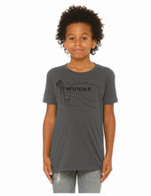 Load image into Gallery viewer, A child model wearing a dark gray crewneck t-shirt with a black graphic of the Hollywood sign and palm trees, paired with light gray jeans, against a plain white background.