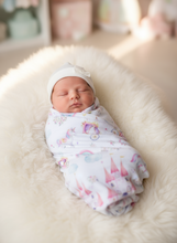 Load image into Gallery viewer, Newborn baby swaddled in a blanket with princess pattern on a soft surface
